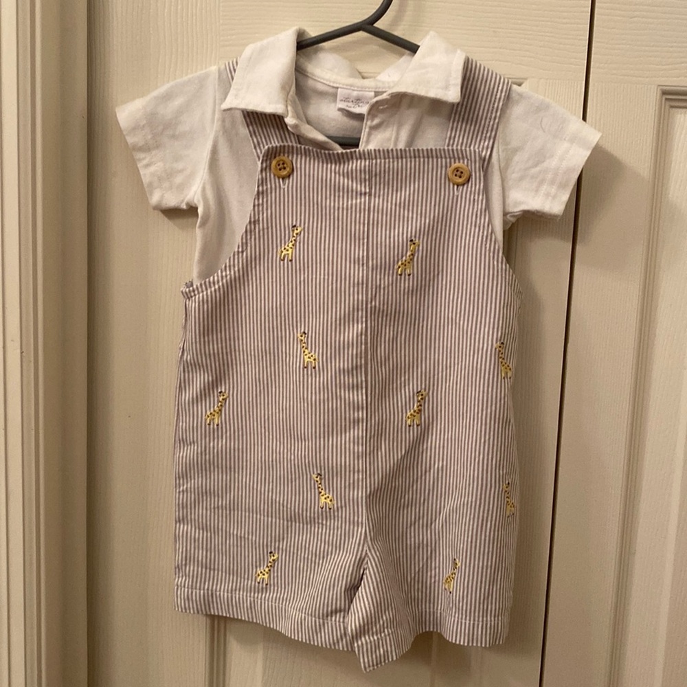 Tan with white strips overalls with white polo.